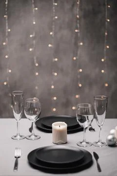 A table set in the restaurant. Serving a table. Grey artistic background. Black Foto stock