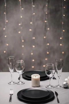 A table set in the restaurant. Serving a table. Grey artistic background. Black Foto stock