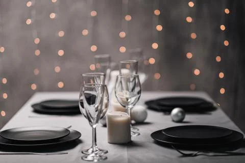 A table set in the restaurant. Serving a table. Grey artistic background. Black Foto stock