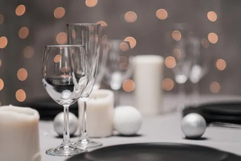 A table set in the restaurant. Serving a table. Grey artistic background. Black Stock Photos