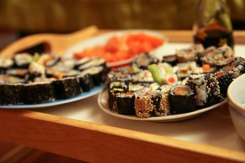 Table with a set of rolls and sauce Stock Photos