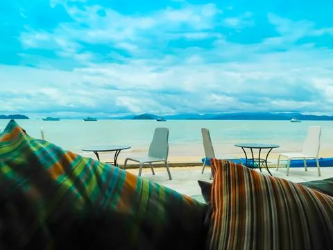 A Table Set up for  a romantic meal on the beach  and sky and sea in the backgro Stock Photos