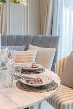 Table set on round table dining in luxury dining room Stock Photos
