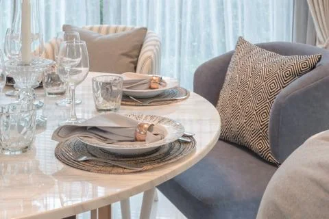 Table set on round table dining in luxury dining room Stock Photos