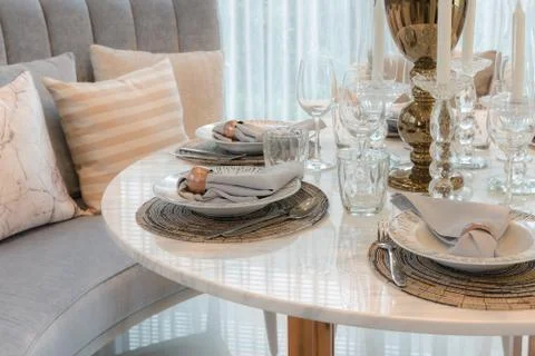 Table set on round table dining in luxury dining room Stock Photos