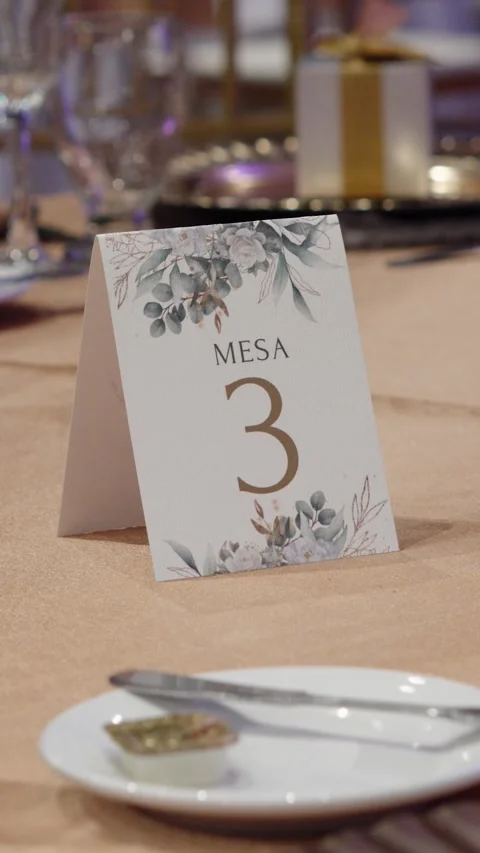A table set for a wedding dinner and a sign with the number 3 in the center Stock Footage 270082577