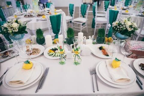 Table set for wedding or another event in green color 写真素材