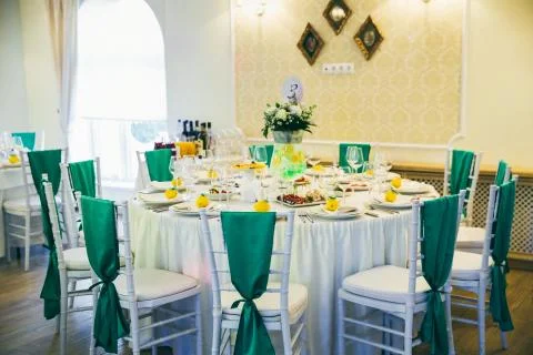 Table set for wedding or another event in green color 写真素材