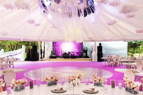 Table set for wedding or another catered event dinner and large white dome Stock Photos