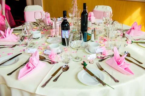 Table set for a Wedding reception with bottles of wine Stock Photos