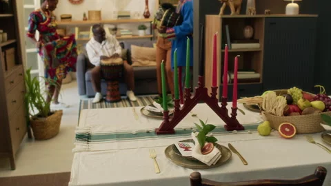 Table Set with White Cloth, Plates, Cutlery, Fruit Basket and Candleholder Stock Footage 319893745