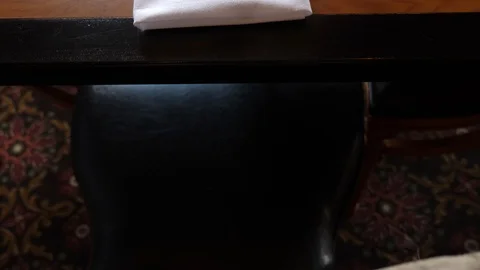 Table set at z's steak and chop house four seats flower vase fork and knife i Stock Footage 89384059