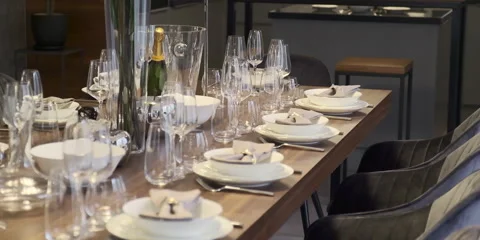 Table setting on background of interior in home with flower Msspe. Stock Footage 150587114