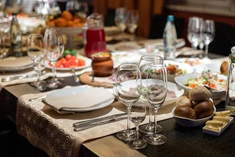 Table setting for a banquet or celebration.Empty glasses for alcoholic beverages Stock Photos