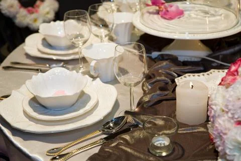 Table setting in beige and brown for elegant dinner Stock Photos
