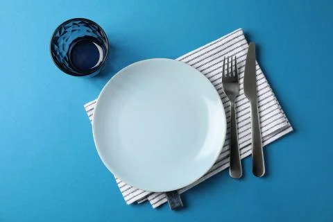Table setting on blue background, top view Stock Photos