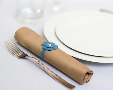 Table setting with brown napkin Stock Photos