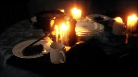 Table setting in candlelight at night Illustration