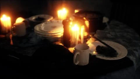 Table setting in candlelight at night Illustration