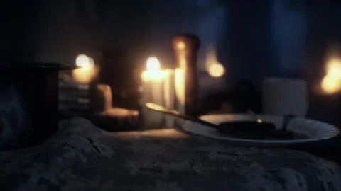 Table setting in candlelight at night Illustration