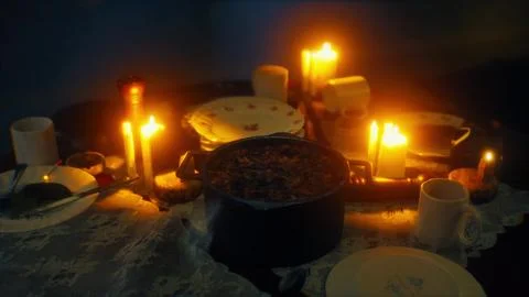 Table setting in candlelight at night Illustration