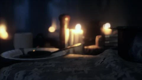 Table setting in candlelight at night Illustration
