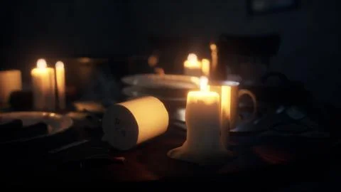 Table setting in candlelight at night Illustrazione stock
