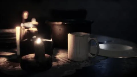 Table setting in candlelight at night Illustrazione stock