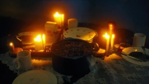 Table setting in candlelight at night Illustration