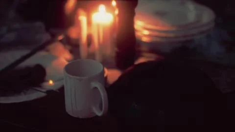 Table setting in candlelight at night Illustrazione stock