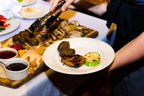 Table setting with cheese and meat dishes Stock Photos
