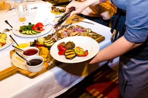 Table setting with cheese and meat dishes Stock Photos