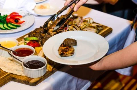 Table setting with cheese and meat dishes Stock Photos