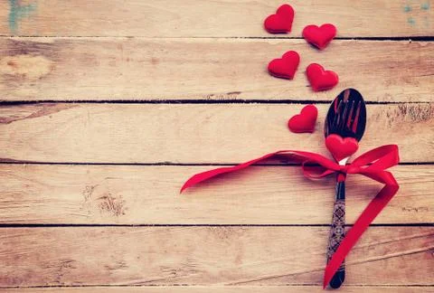 Table setting cutlery and red heart for dinner Valentine Day. Stock Photos