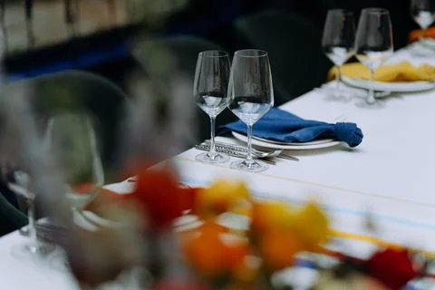 Table setting with dishes, blue tablecloth. Mediterranean style. Stock Photos