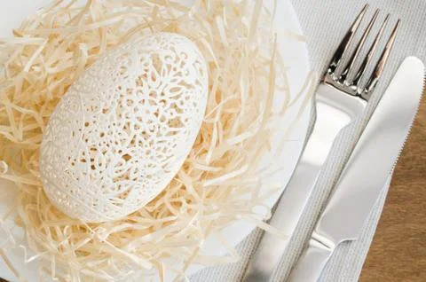 Table Setting for Easter Celebration. Carved Egg. 스톡 사진