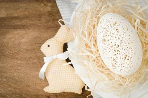 Table Setting for Easter Celebration. Carved Egg. Stock Photos