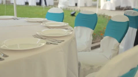 Table setting with eating utensils on a gorgeous banquet Stock Footage 59907941