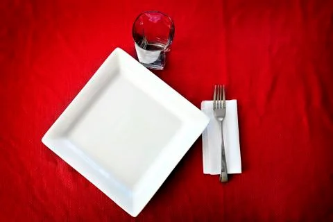 Table Setting with Fancy Plate Fork Cup and Covering Cloth Stock Photos