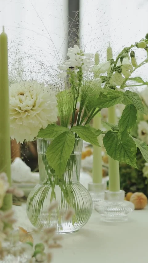 Table Setting Featuring Floral Arrangements and Candles. Wedding decor Stock Footage 306156037