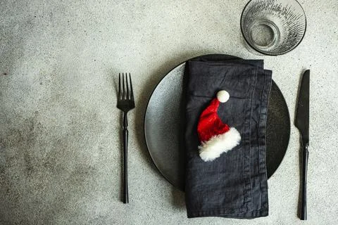 Table setting for festive Christmas dinner on concrete table Stock Photos