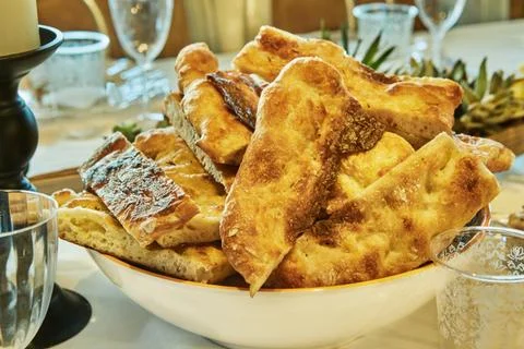 Table setting with focaccia bread and candles Stock Photos