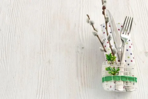 Table setting with fork, knife and willow branches for Easter, birthday or mo Stock Photos