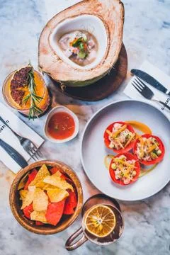 Table setting full of latin dishes such as ceviche, tortilla chips, tostadas, Stock Photos