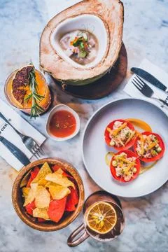 Table setting full of latin dishes such as ceviche, tortilla chips, tostadas, Stock Photos