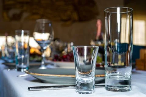 Table setting. Glass, stack, bowls and fork on the table Stock Photos