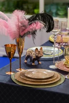 Table setting in gold and pink color, for a wedding or other event, wine glas Stock Photos