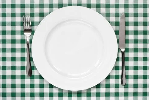 Table setting on green gingham tablecoth Stock Photos