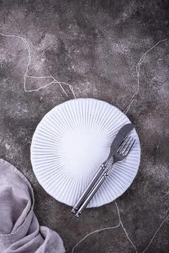Table setting on grey concrete background Stock Photos