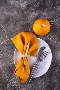 Table setting on grey concrete background Stock Photos